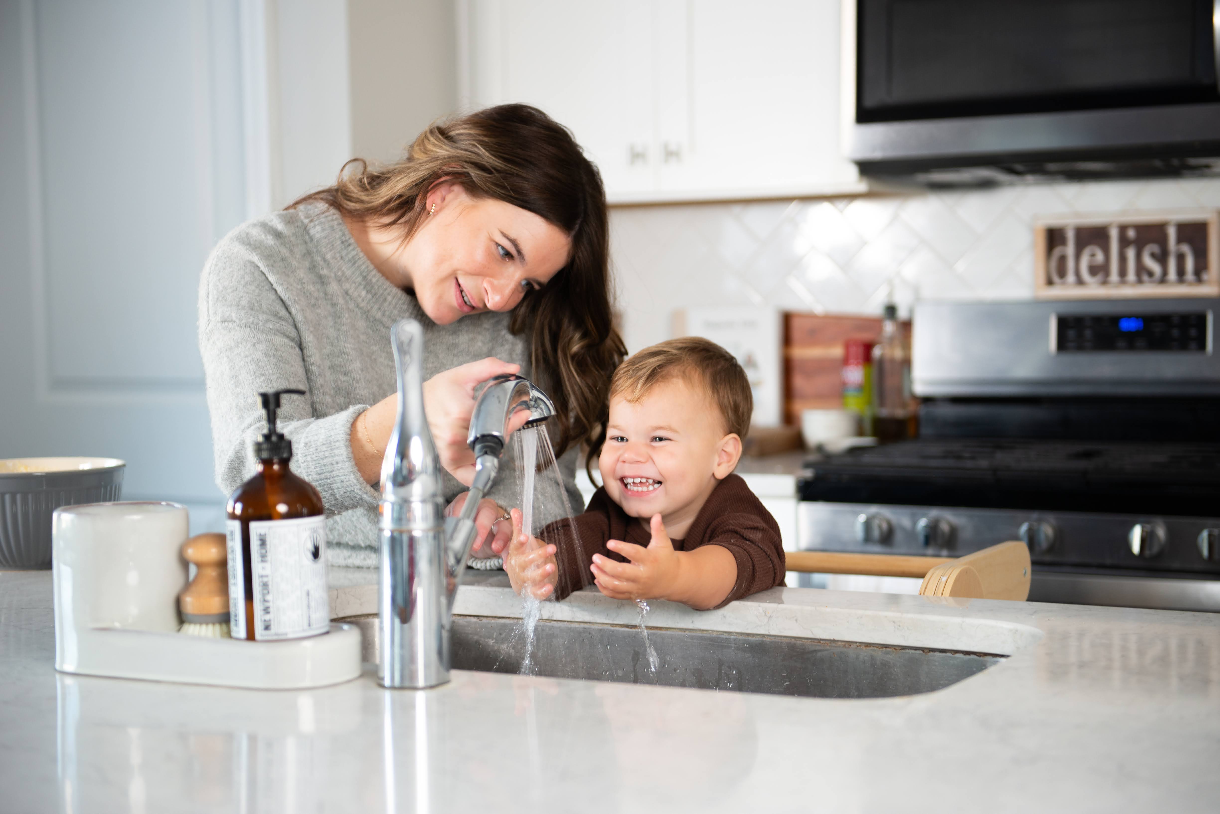 Mom and son washing hands