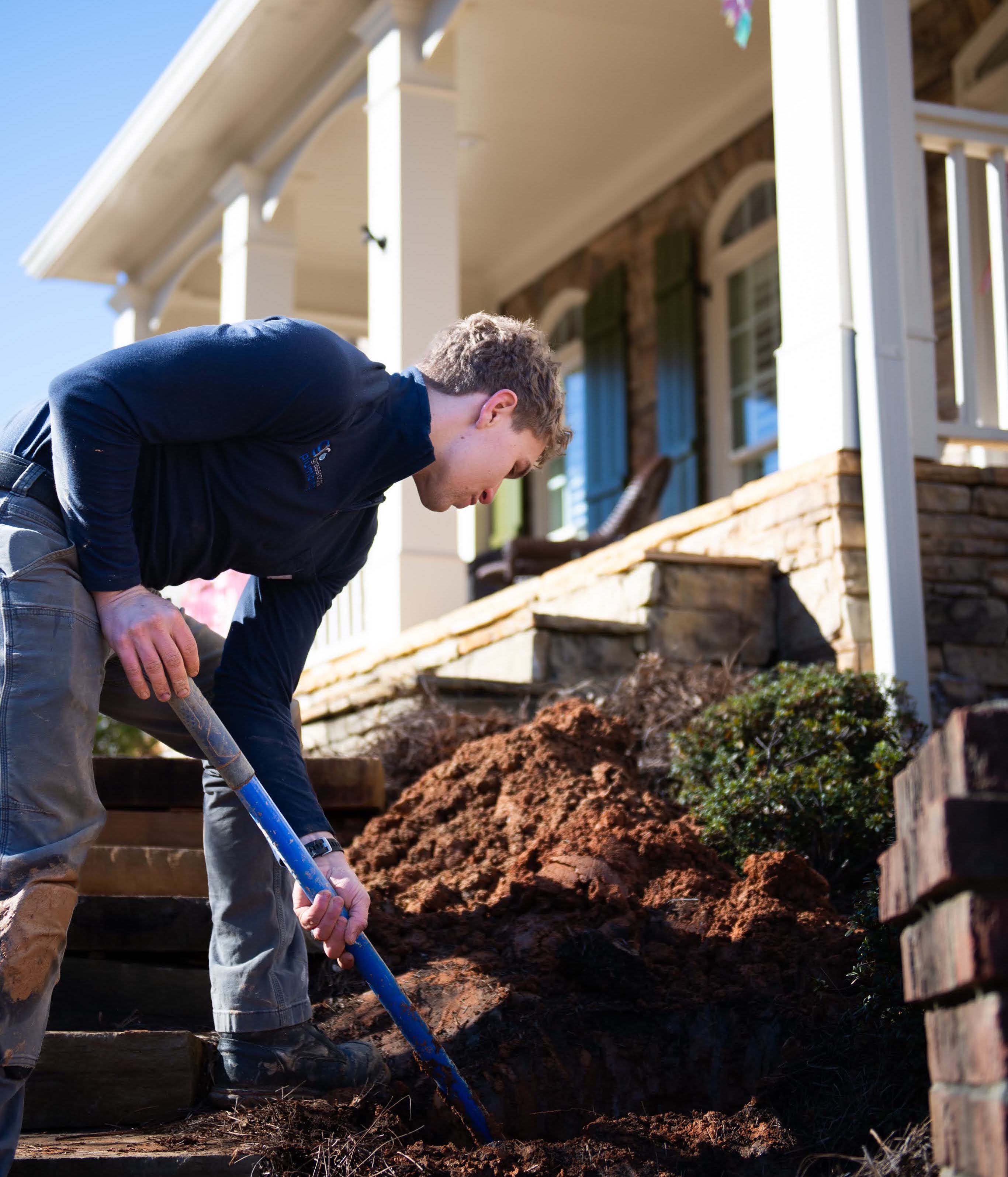 Plumber digging a water line