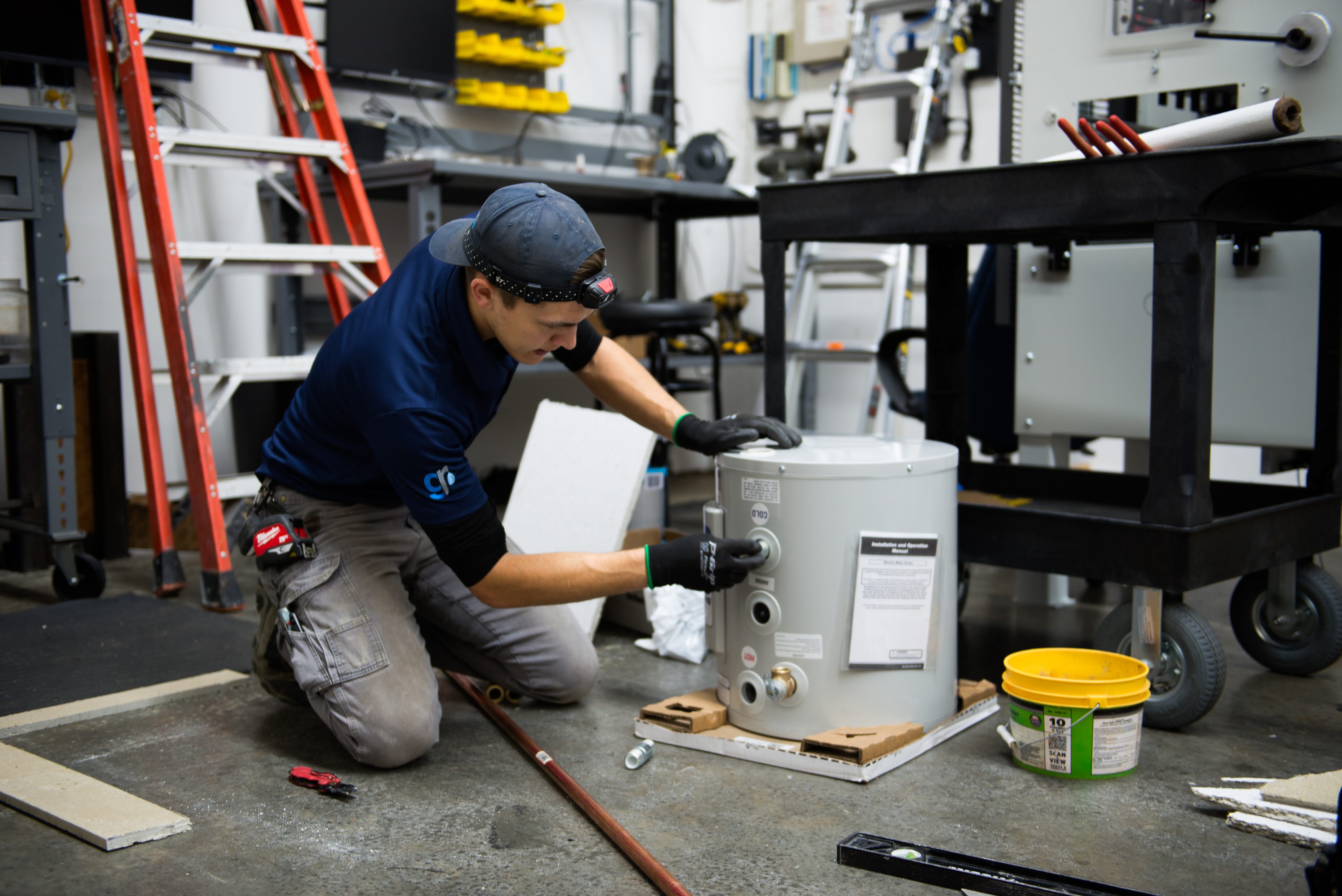 Plumber working on water heater