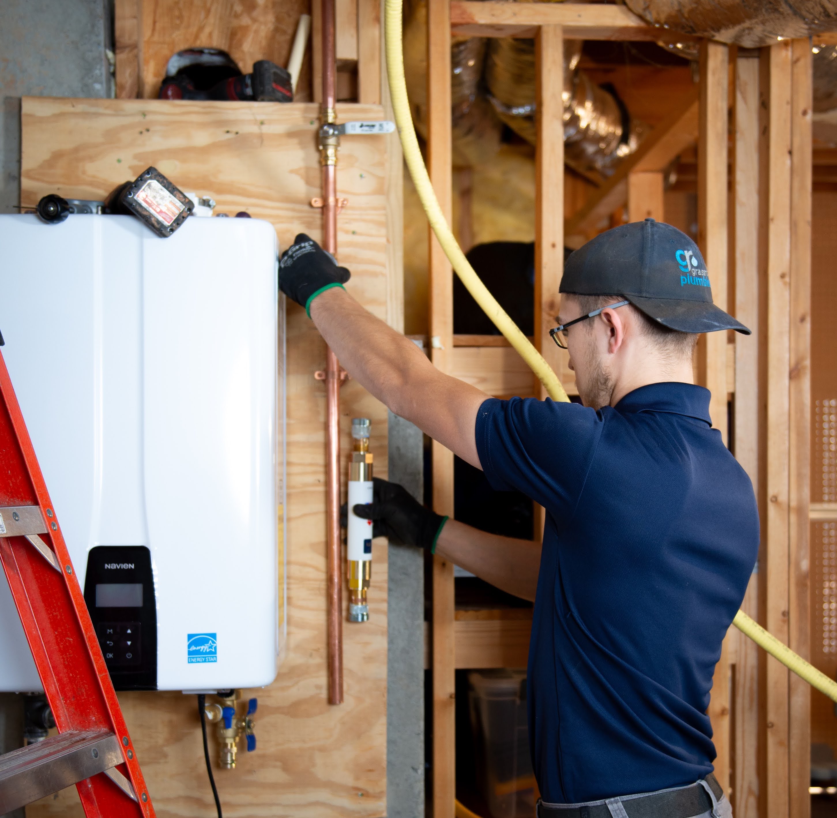 Plumber working on a copper pipe